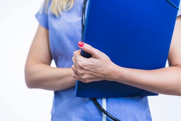 A close-up shot of a medical professional's hand pointing to a document labeled 