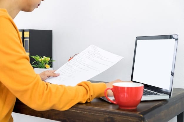A person sitting at a desk, filling out forms with a focused expression, symbolizing the application process for SSI benefits. A laptop displaying the SSA website is in the background.
