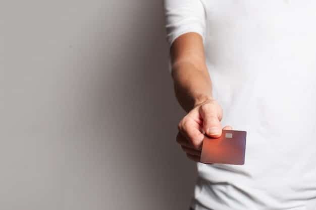 A close-up of a Social Security card with a person's hand gently holding it. The background is slightly blurred, emphasizing the card.