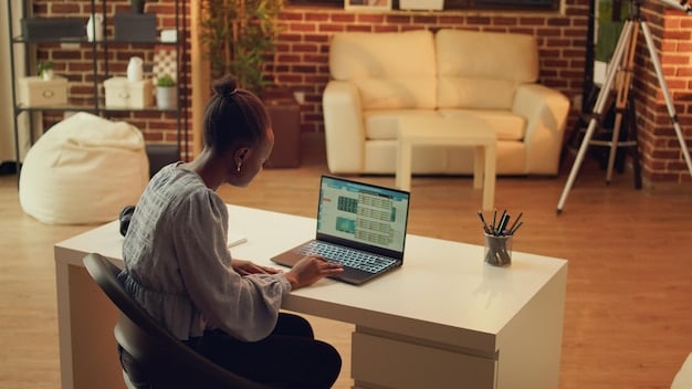 An individual sitting at a desk, working on a laptop, with the ACP application website displayed on the screen. The scene is well-lit and conveys a sense of empowerment through access to affordable internet.