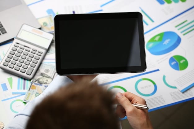 A person holding a modern calculator while reviewing a document filled with numbers and charts, symbolizing a detailed financial analysis and decision-making process related to tech purchases.