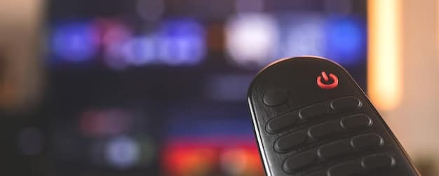 Close-up shot of a smart remote control with illuminated buttons, controlling a variety of home theater devices, symbolizing convenience and integrated control.