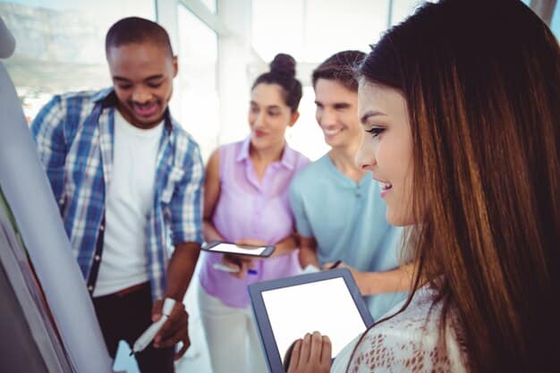 A diverse group of young professionals collaborating on a project, surrounded by laptops and whiteboards filled with notes, demonstrating effective networking and collaboration.
