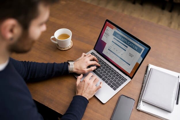 A person's hand typing on a laptop, with a blurred LinkedIn profile page showing on the screen, emphasizing professional online presence and digital networking.