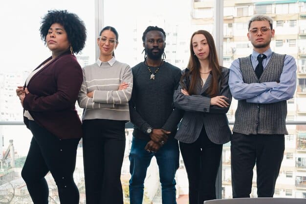 A diverse team of business professionals (includes individuals of various ethnicities and ages) engaged in a video conference call, with multiple screens showing their faces. They are smiling, actively listening, and one person is gesturing animatedly, emphasizing effective global communication. A world map is subtly visible in the background.