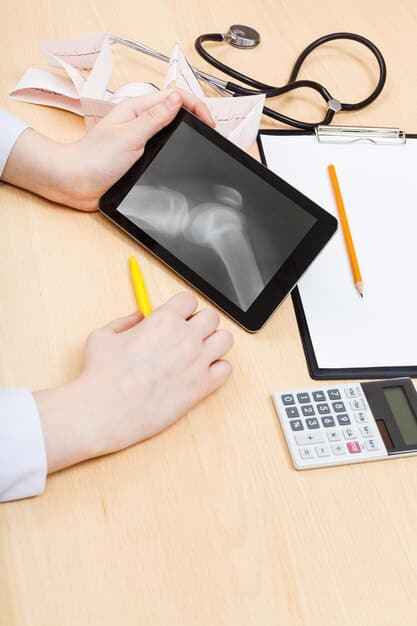 A close-up of a hand using a calculator, with healthcare documents blurred in the background, symbolizing the financial calculation of premiums.