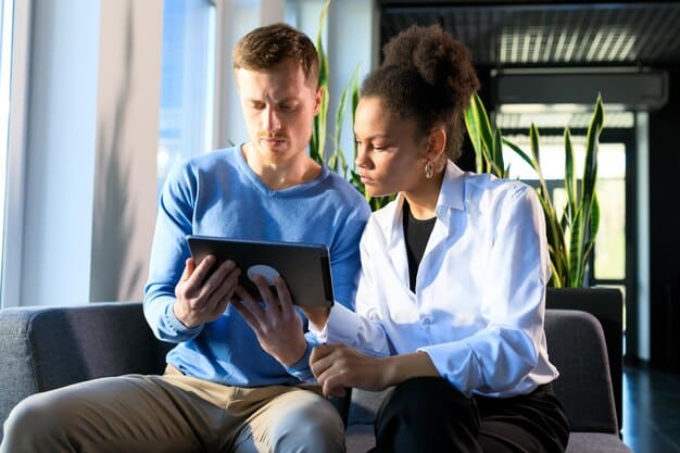 A healthcare professional explaining a screening test result to a calm adult patient using a digital tablet, demonstrating clarity and modern medical communication.