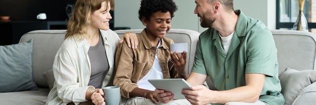 A family smiling while reviewing medical bills together, suggesting that the New Legislation Alert: Congress Approves Bill Aiming to Reduce Healthcare Costs by 10% may ease their financial burden and bring them peace of mind.