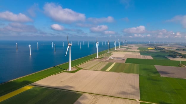 An aerial view of a large offshore wind farm, with multiple wind turbines standing tall in the ocean. The sky is clear and blue, and the turbines are evenly spaced. The image symbolizes clean energy generation using wind power. Demonstrates Critical Analysis: The Future of US Energy Policy - Experts Weigh In on Renewable Energy Goals within the scope of wind energy.