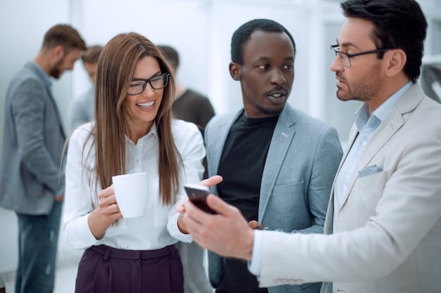 A diverse group of professionals engaging in a networking event, exchanging business cards and conversing animatedly. Illustrates the importance of in-person connections and active participation. Relates to Building Your Personal Brand: Stand Out From the Crowd and Get Noticed.