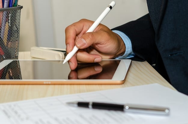 A close-up image of someone filling out a government form with a pen. The forms are related to government assistance.
