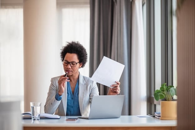 A person sitting at a desk with multiple forms and documents related to government benefits, highlighting the importance of organization and attention to detail in meeting deadlines. The scene emphasizes Don't Miss Out: Key Deadlines for US Government Benefits in 2025.