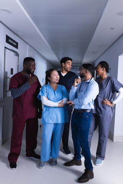 A close-up shot of a diverse group of doctors and nurses in a hospital setting, looking at a digital display with a patient's medical chart. The chart mentions terms related to clinical trials or new treatment options.