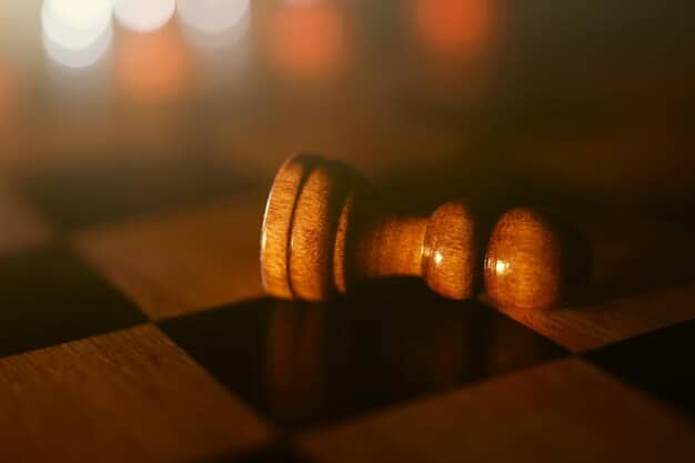 A close-up of a gavel hitting a sound block in a courtroom. The focus is sharp on the gavel and block, with blurred legal documents in the background. This symbolizes the enforcement of Mental Health Parity: Are Insurance Companies Finally Meeting Their Obligations in 2025?