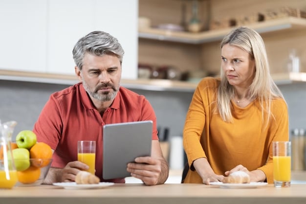 A concerned-looking middle-aged couple is sitting at their kitchen table, reviewing financial documents. The woman is pointing at a document with a graph showing rising healthcare costs. The scene conveys a sense of anxiety and the need for careful financial planning.