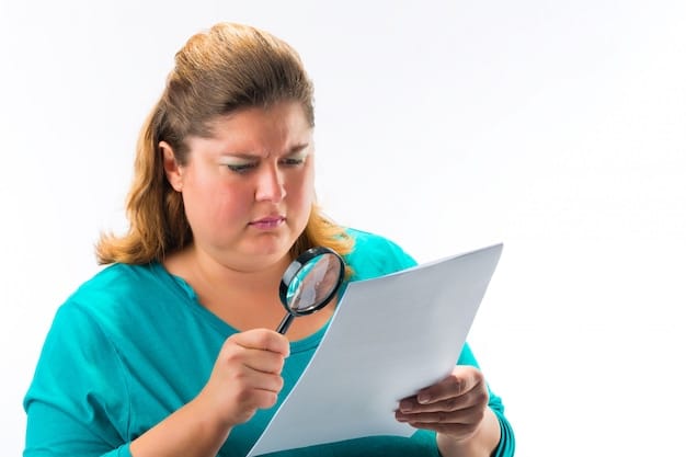 A person carefully examining a medical bill with a magnifying glass. The bill is highlighted with red circles around suspicious charges, emphasizing the need for scrutiny and attention to detail in detecting Healthcare Fraud: How to Spot It and Protect Yourself from Scams in 2025.